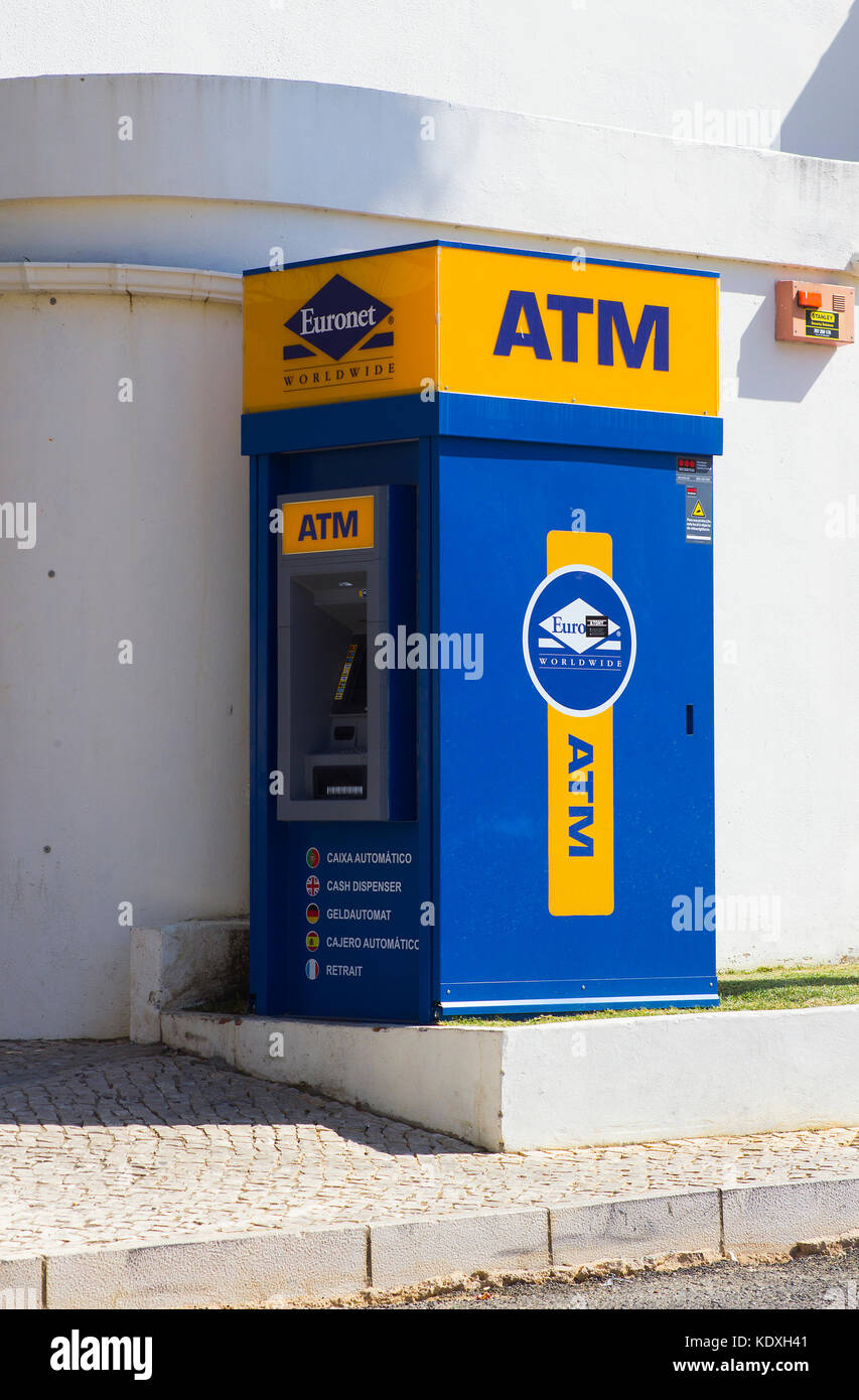 A free standing cash machine on a street pavement outside a grocery store in Albuferia in Portugal Stock Photo
