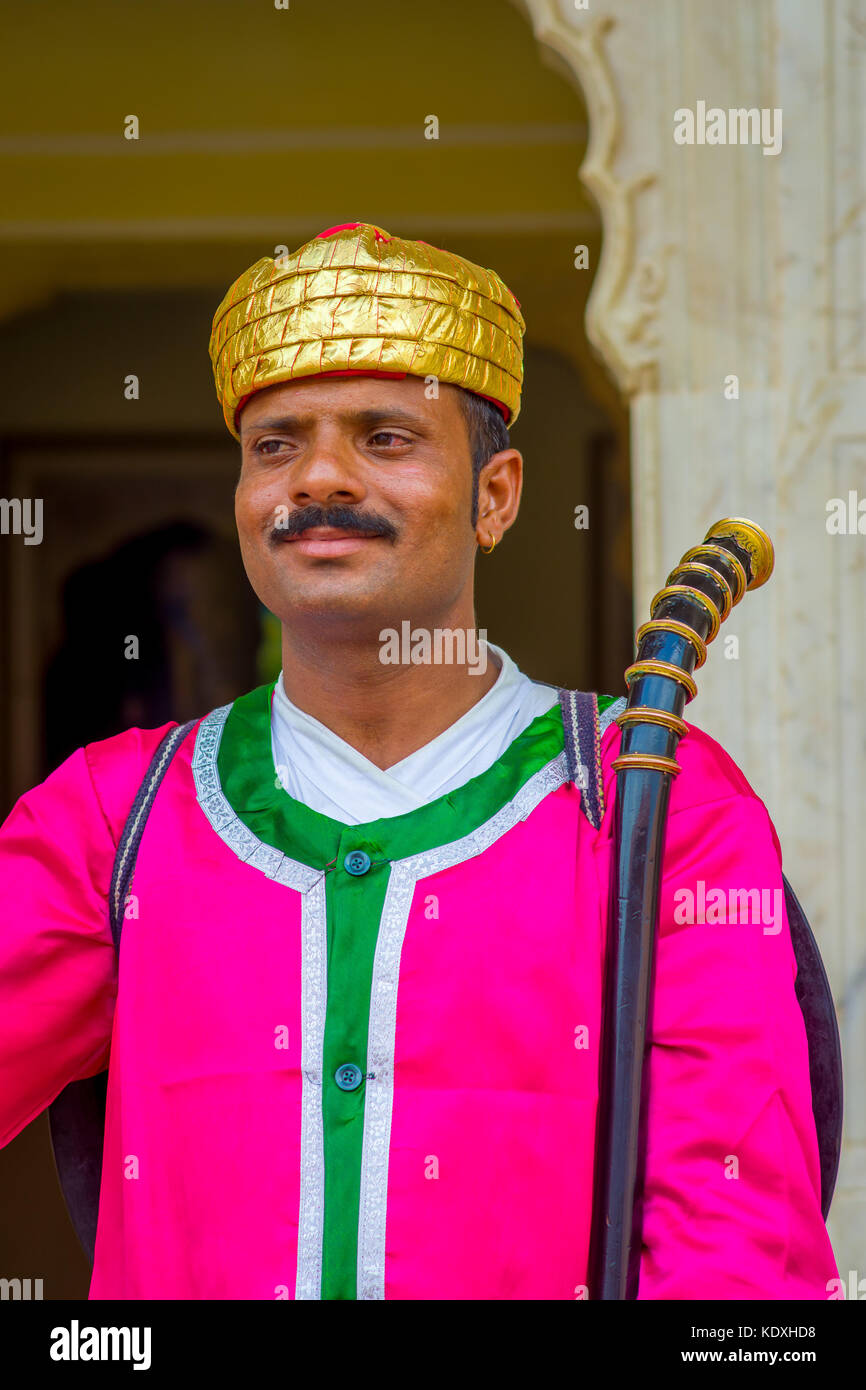 Jaipur, India - September 19, 2017: Portrait of an unidentified Indian man with mustache, wearing a golden crown and pink clothes in Jaipur, India Stock Photo
