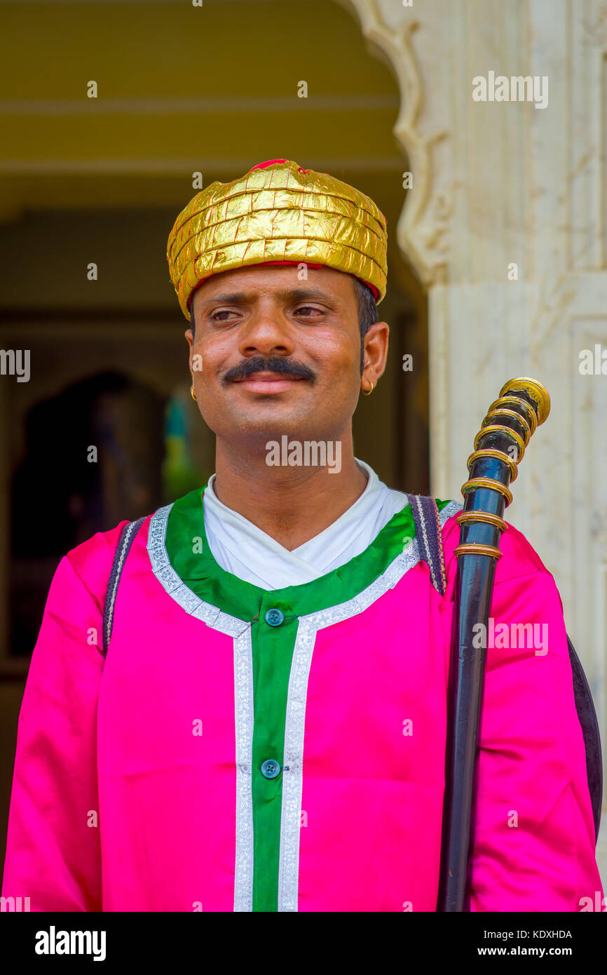 Jaipur, India - September 19, 2017: Portrait of an unidentified Indian man with mustache, wearing a golden crown and pink clothes in Jaipur, India Stock Photo