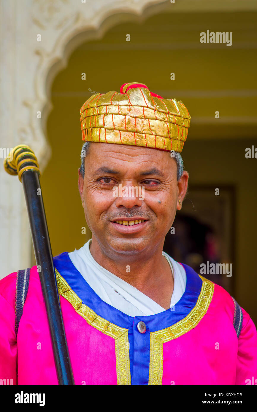 Jaipur, India - September 19, 2017: Portrait of an unidentified Indian man, wearing a golden crown and pink clothes in Jaipur, India Stock Photo