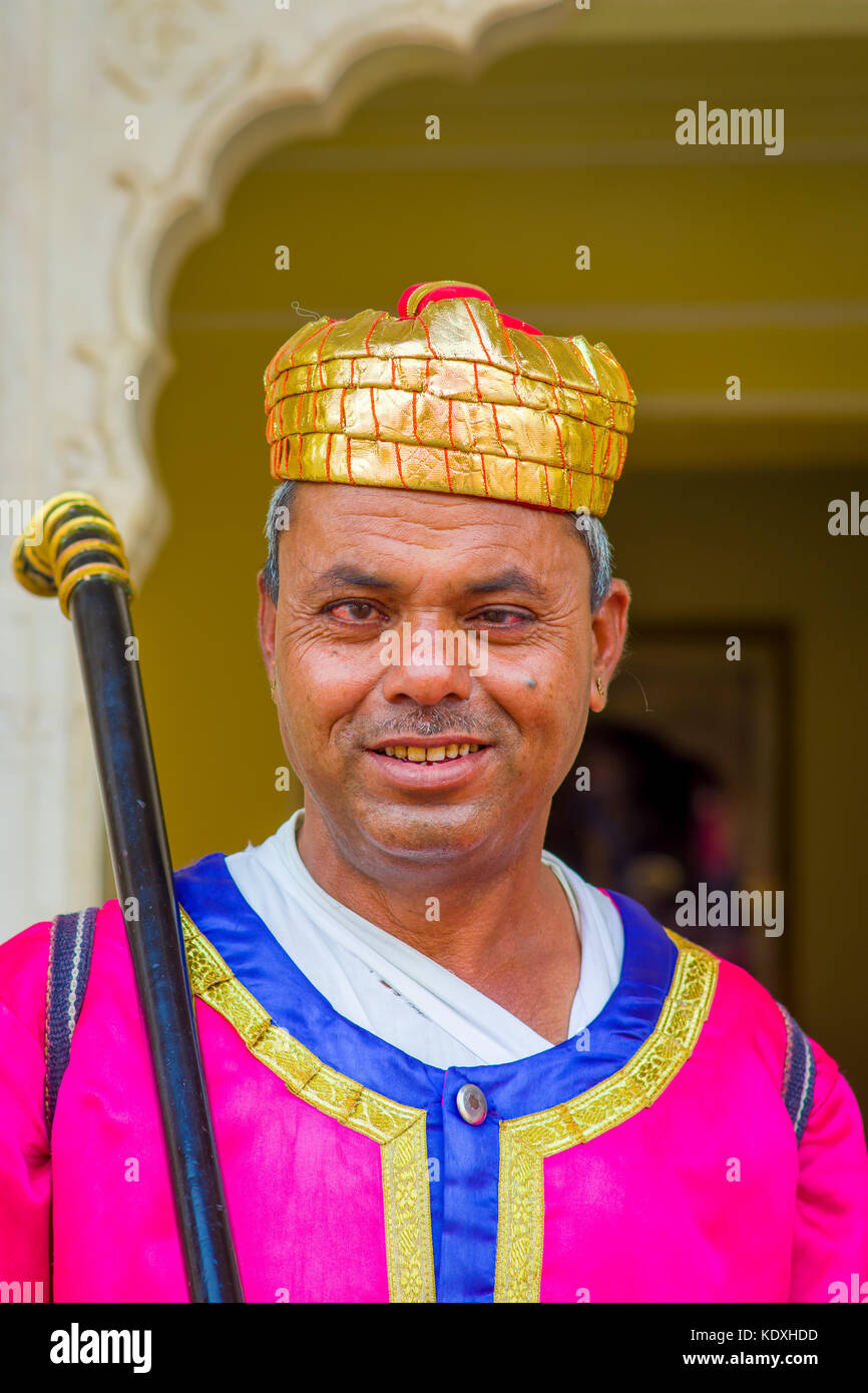 Jaipur, India - September 19, 2017: Portrait of an unidentified Indian man, wearing a golden crown and pink clothes in Jaipur, India Stock Photo