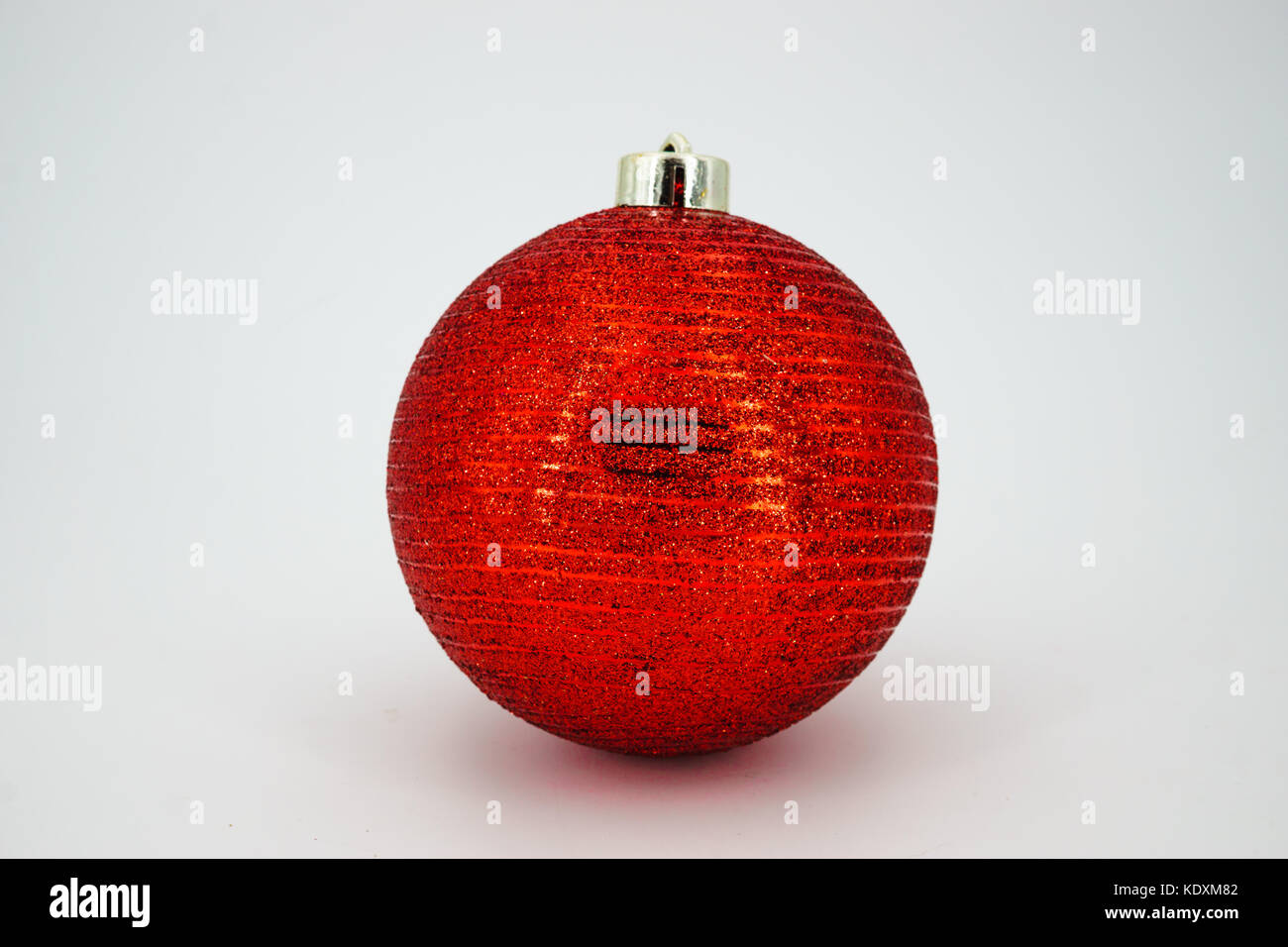red christmas ball over white background isolated Stock Photo - Alamy
