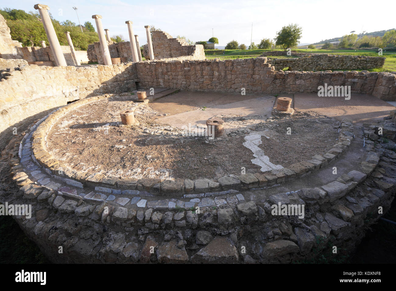 A view of Roman latrines at the site of a collection of mosaics considered to be the finest in the world at Piazza Armerina. From a series of travel p Stock Photo