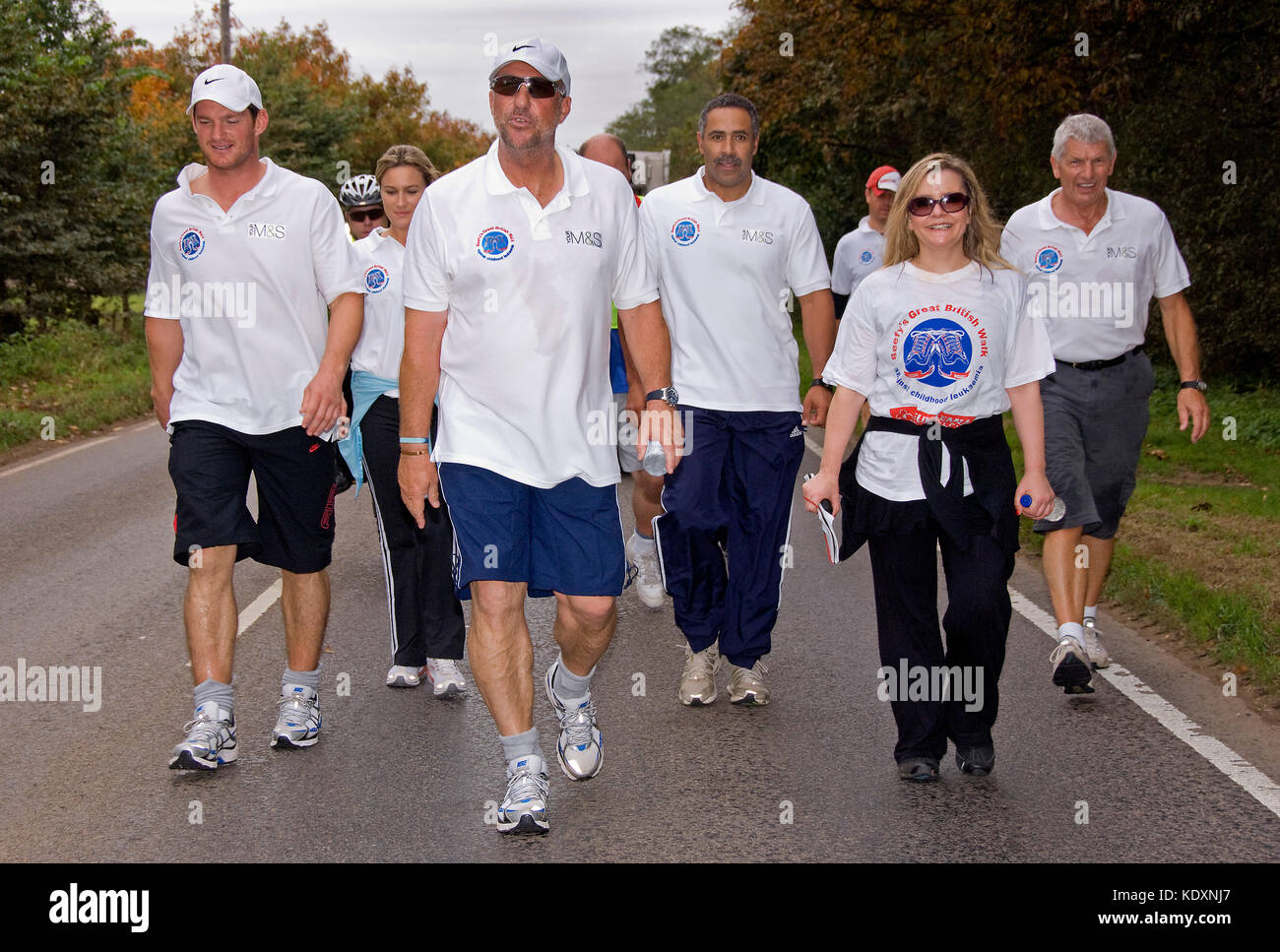 Sir Ian Botham on his charity walk in Stratford-upon-Avon (Beefy's Great British Walk - Against Childhood Leukemia) with his son Liam(black shorts) Stock Photo
