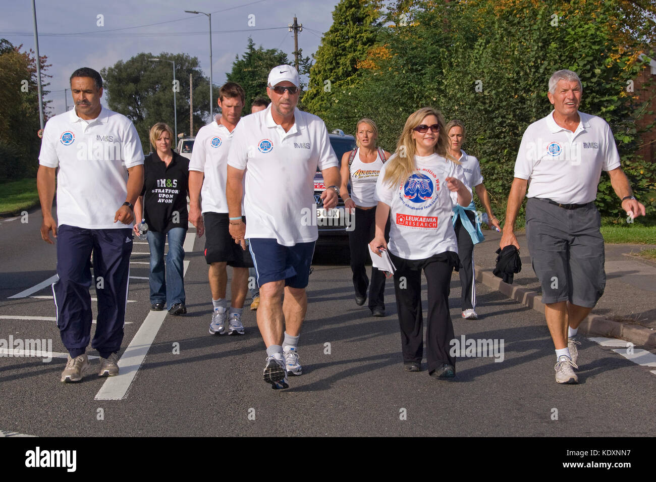 Sir Ian Botham on his charity walk in Stratford-upon-Avon (Beefy's Great British Walk - Against Childhood Leukemia) with his son Liam(black shorts) Stock Photo