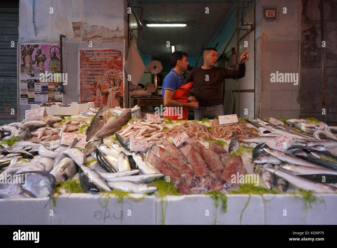 Two market vendors at a fish stall in a market in Palermo. From a series of travel photos in Sicily, Italy. Photo date: Tuesday, October 10, 2017. Pho Stock Photo