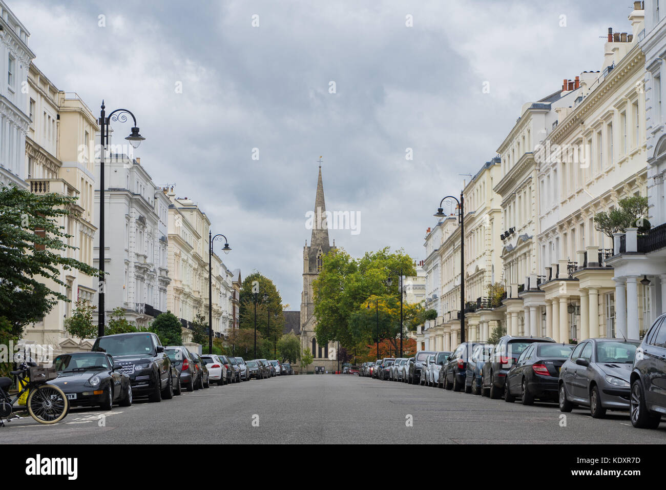 Kensington Park Gardens street with the Notting Hill St John's church in the background 2017, London, UK Stock Photo