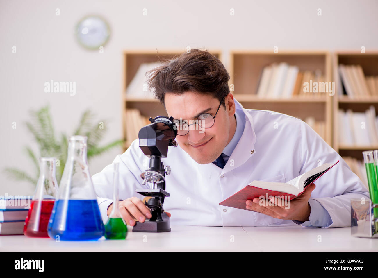 Mad crazy scientist doctor doing experiments in a laboratory Stock ...