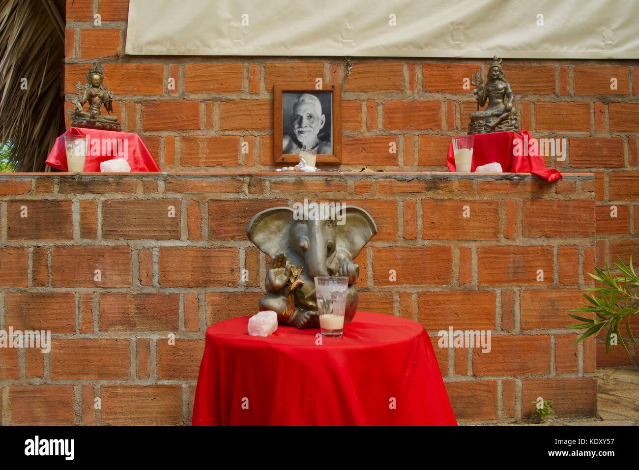 A portrait of Ramana Maharshi is displayed with offerings in Mexico Stock Photo