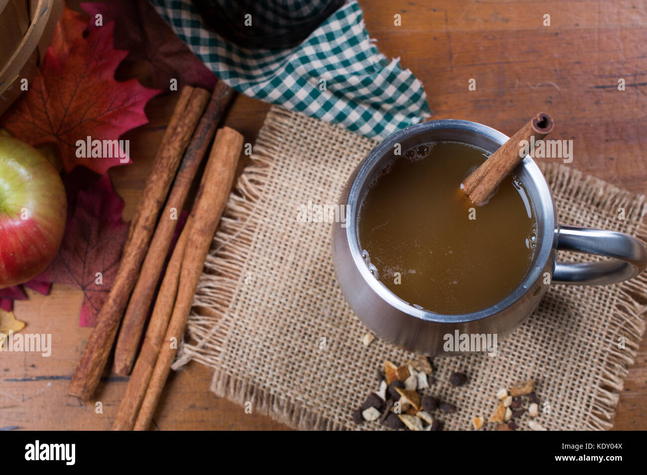 Top view of cup of apple cider in a rustic setting Stock Photo