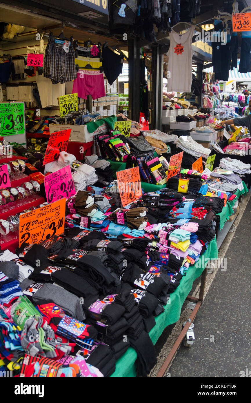 Stall on Bury market selling socks, men's briefs and miscellaneous clothing. Stock Photo