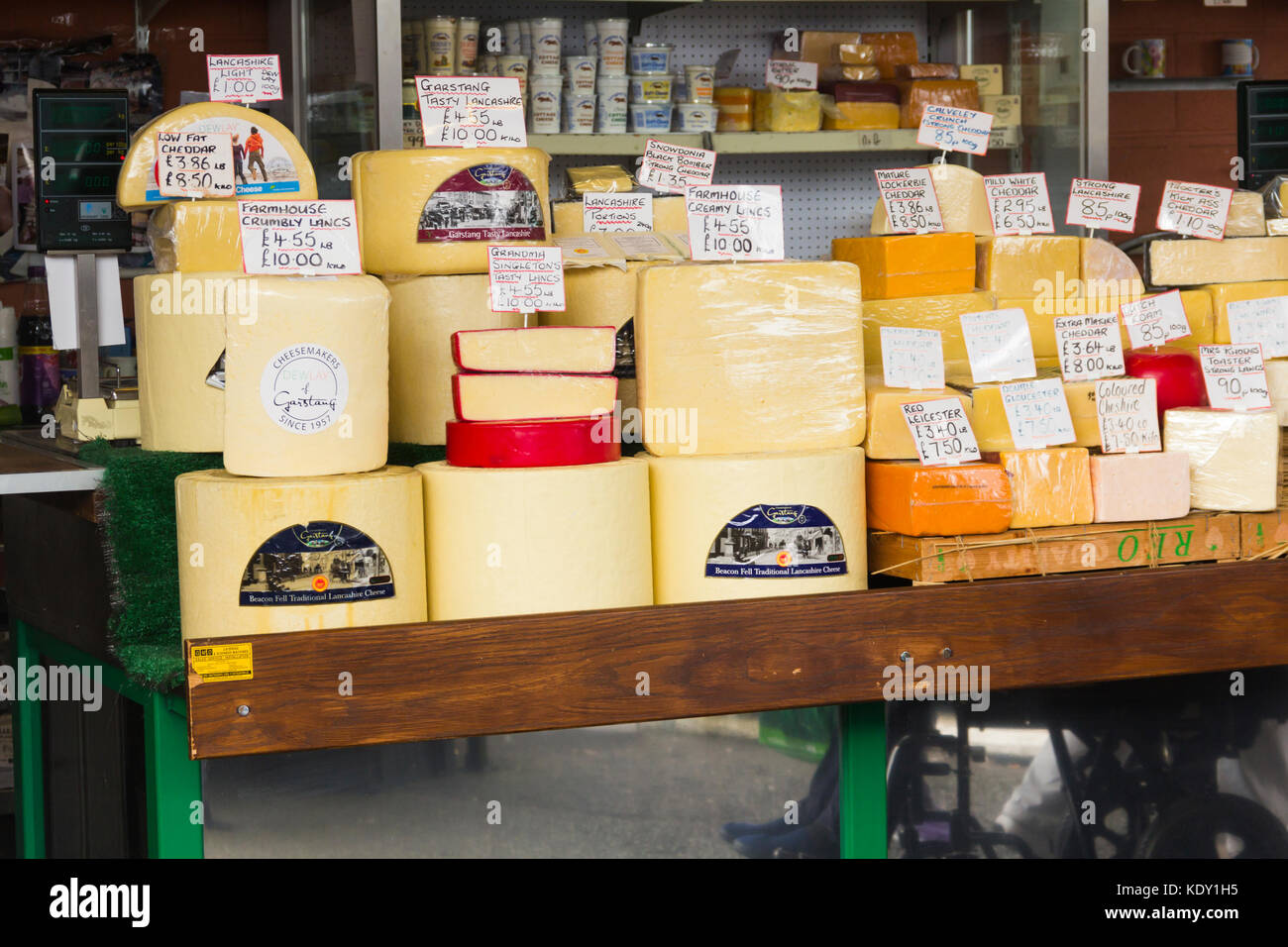 Purdons cheese stall on Bury market. The stall sells a wide range of traditional English cheese specialising in varieties of Lancashire cheese. Stock Photo