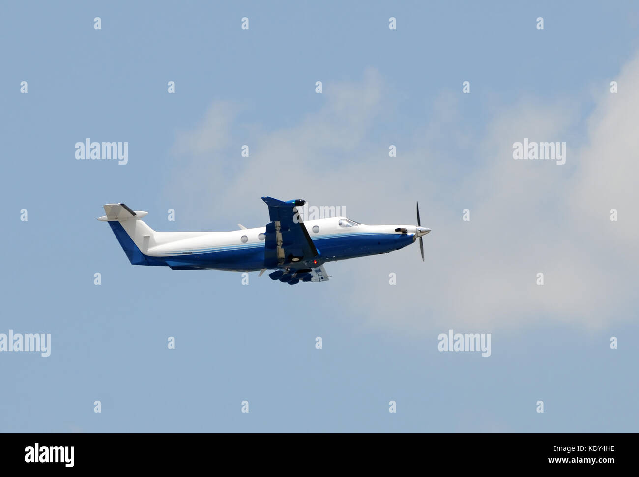Modern turboprop airplane taking off side view Stock Photo - Alamy