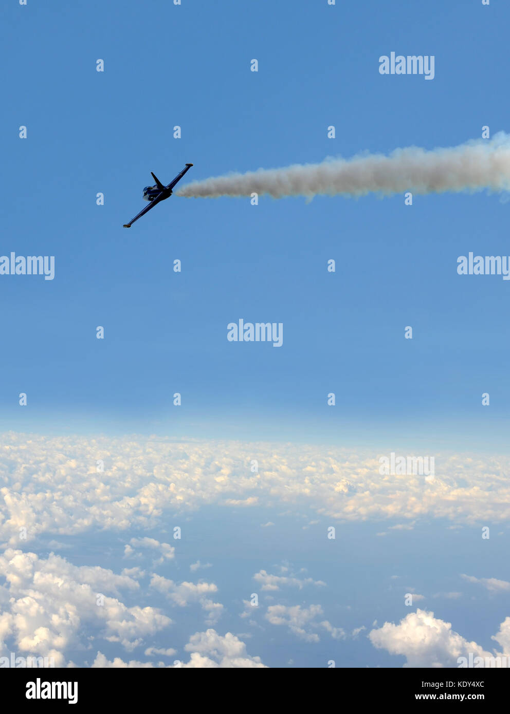 Military jet airplane flying above the clouds Stock Photo - Alamy