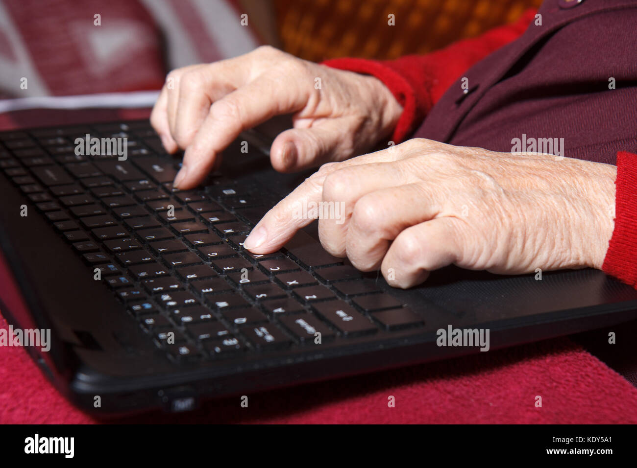 senior women writing on computer Stock Photo