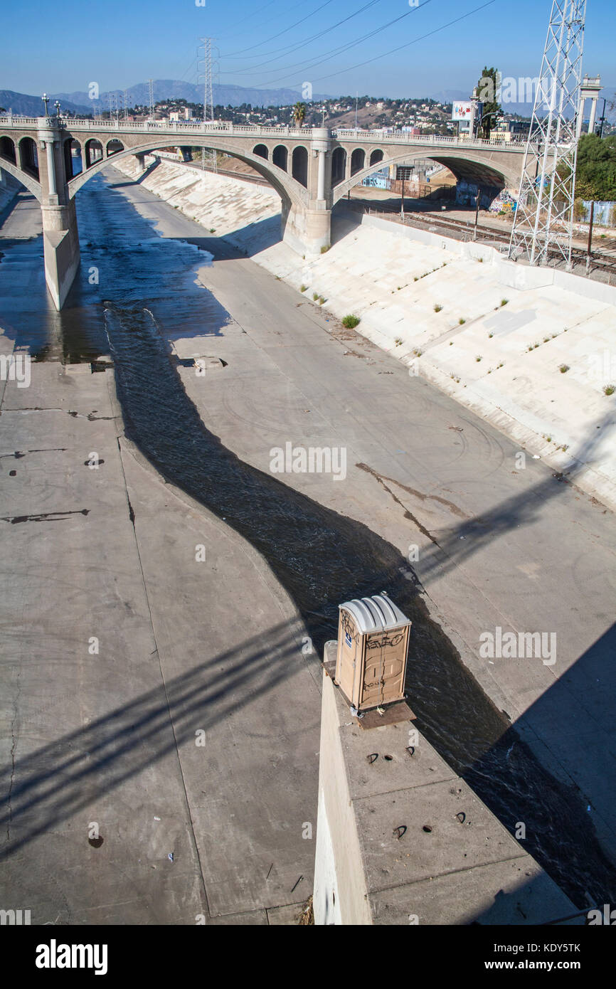 Portotable toilet on ledge of Spring Street Bridge, Los Angeles River, Los Angeles, California, USA Stock Photo