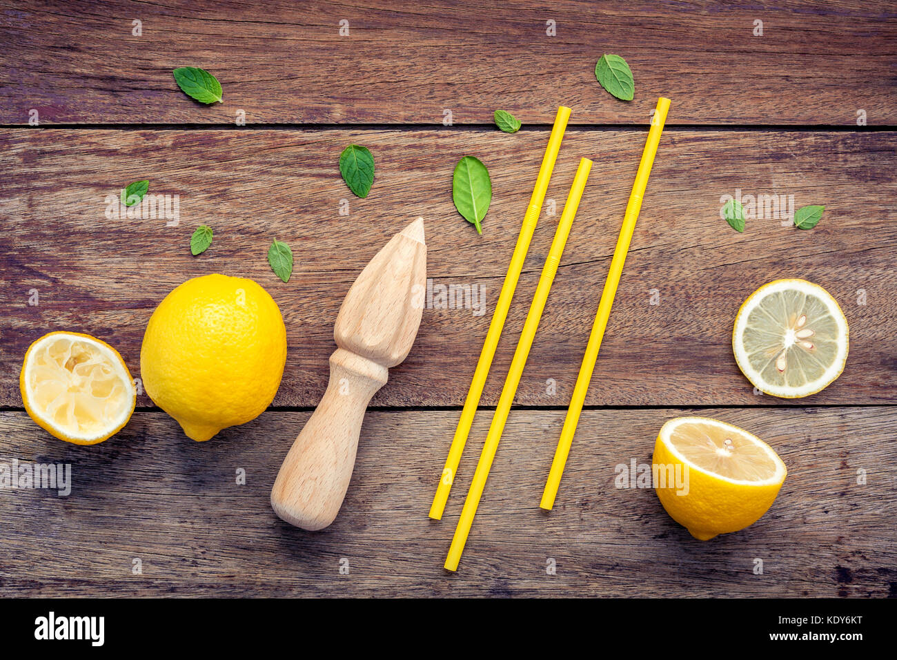 Fresh lemon and wooden juicer for summer juice and cocktail. Fresh