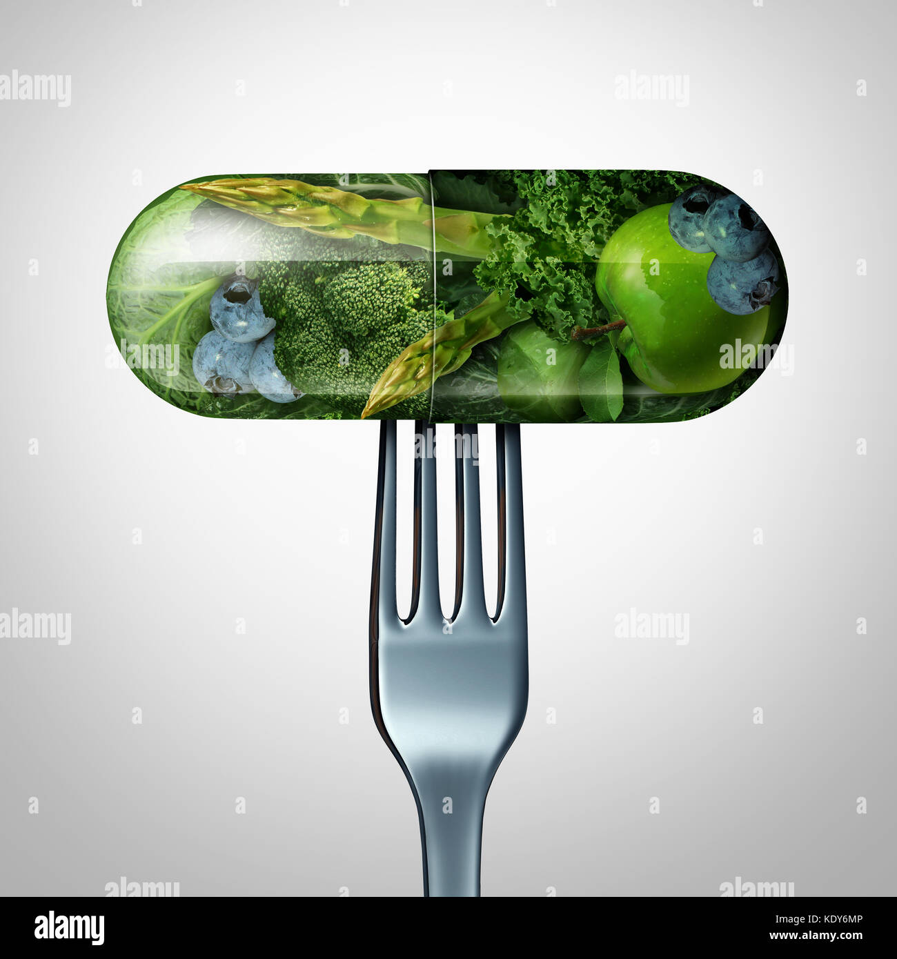 Natural food supplement concept as a pill or medicine capsule with fresh fruit and vegetables inside on a fork as a nutrition and dietary vitamin. Stock Photo