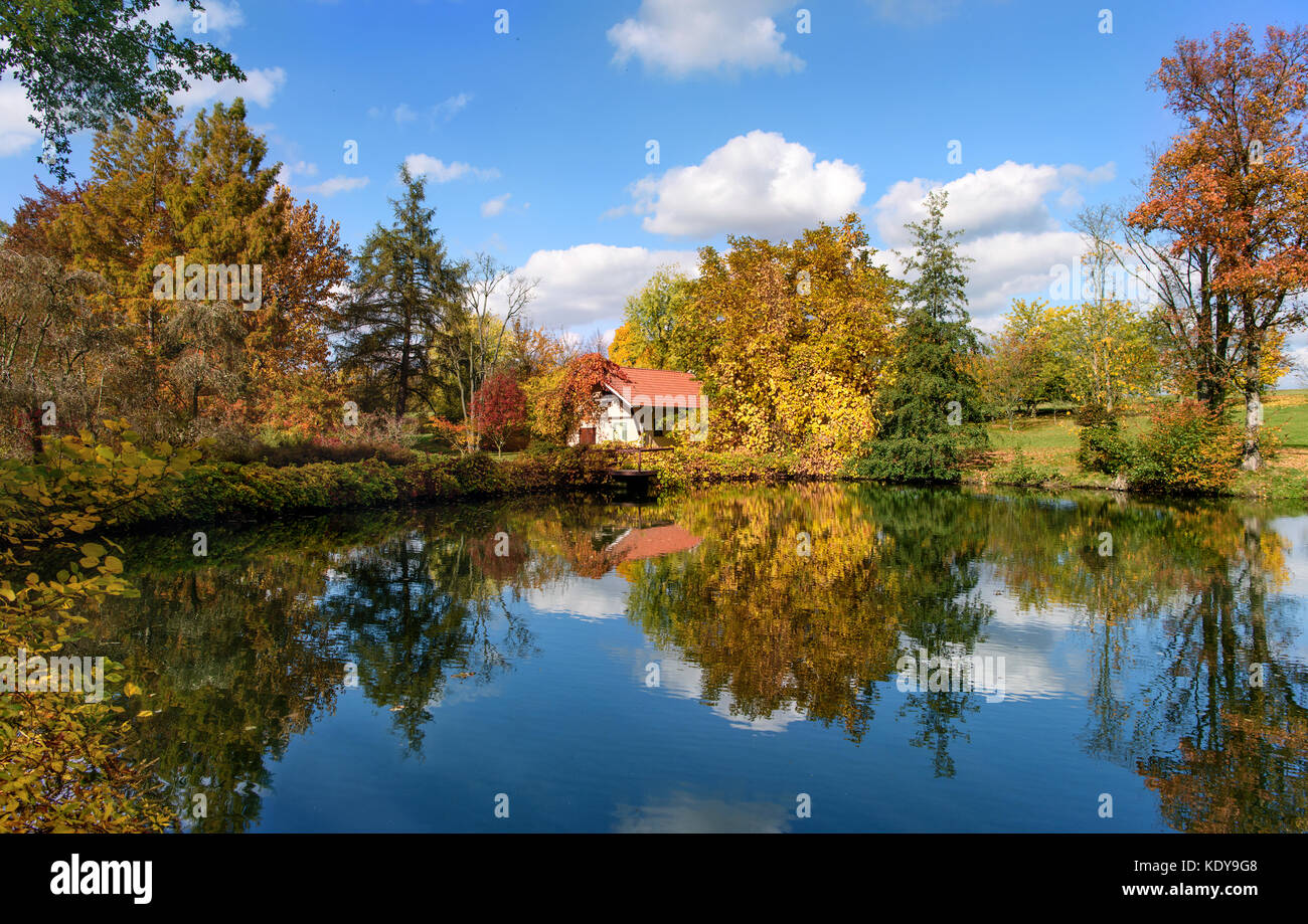 Autumnal park with a lake Stock Photo - Alamy