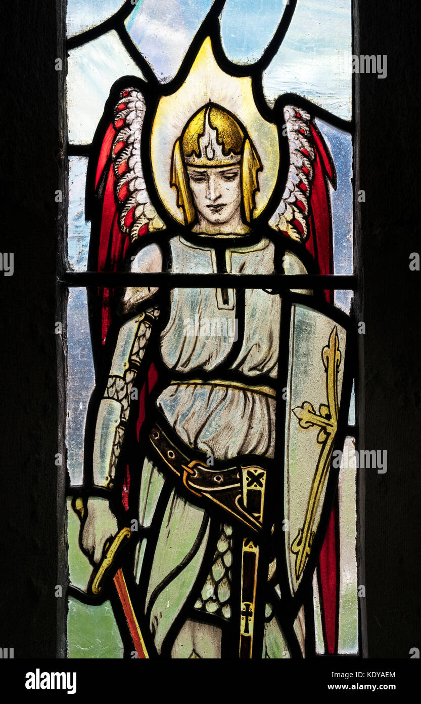 St Michael stained glass window in St Michaels saxon church Duntisbourne rouse, Cotswolds, Gloucestershire, England Stock Photo