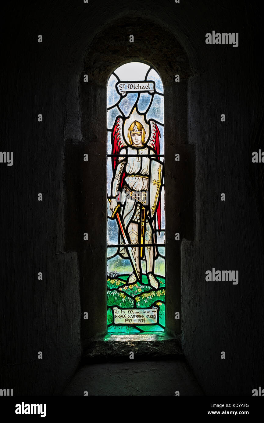St Michael stained glass window in St Michaels saxon church Duntisbourne rouse, Cotswolds, Gloucestershire, England Stock Photo