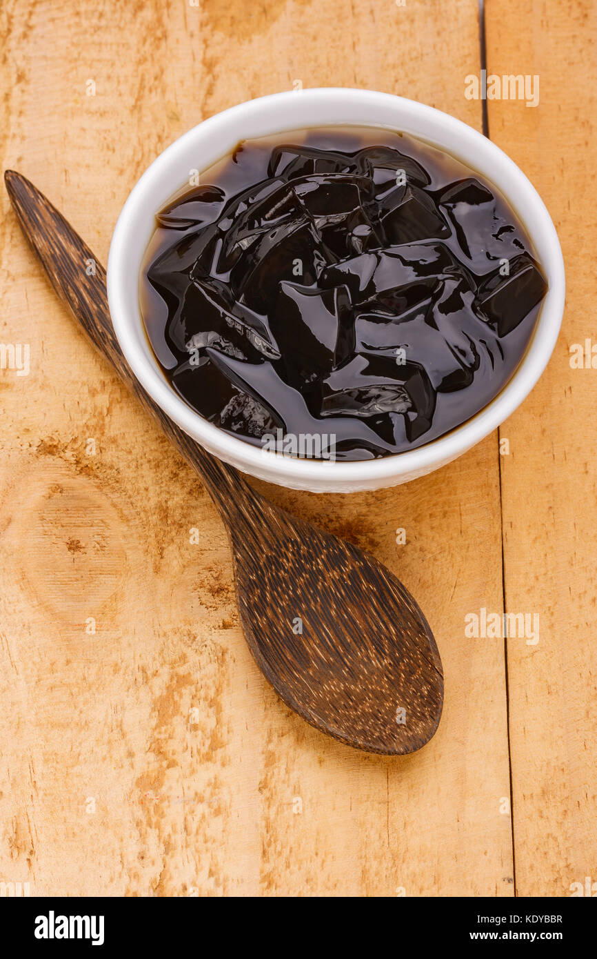 grass jelly or vegetable jelly on wood background Stock Photo Alamy