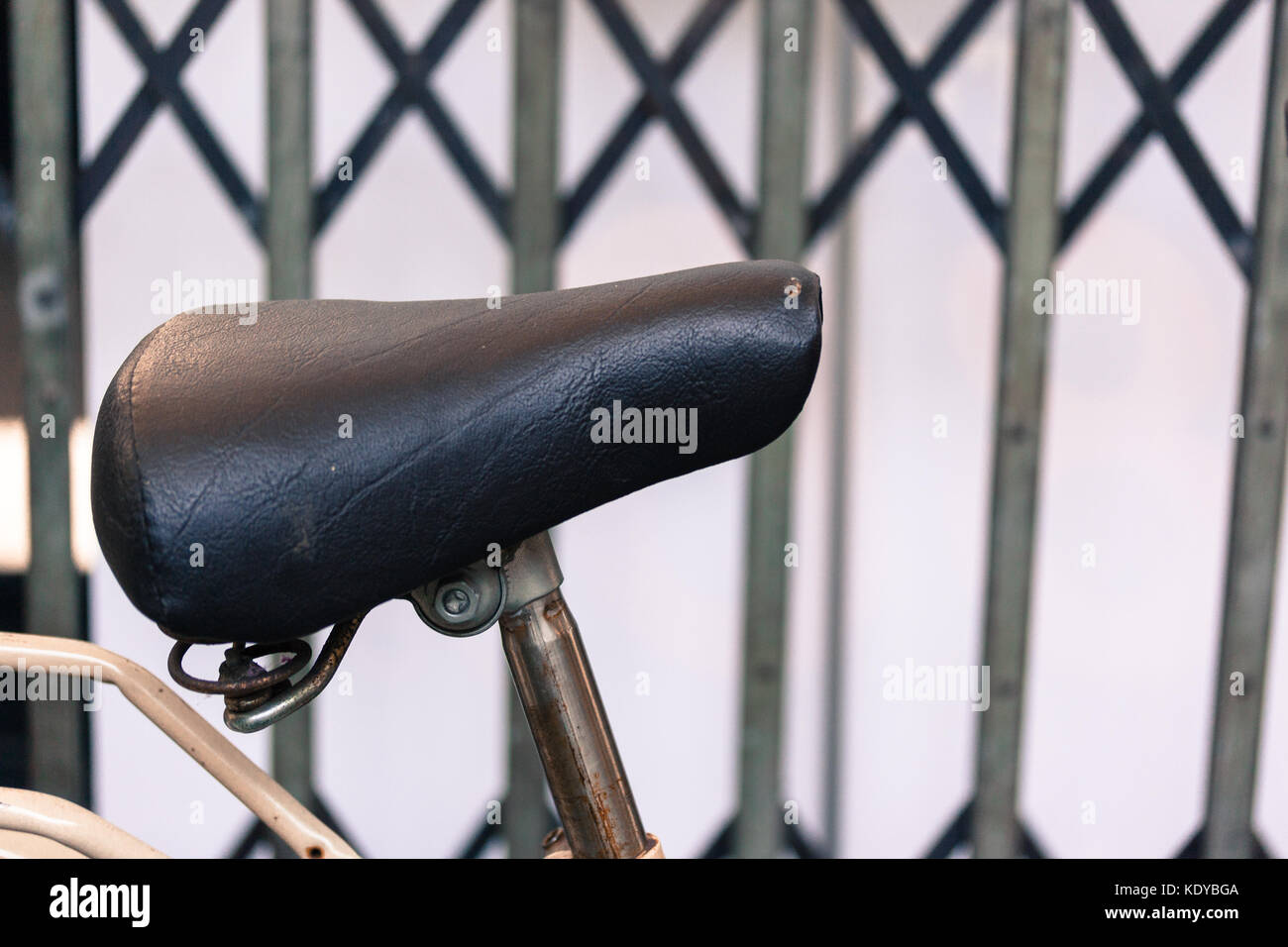 vintage leather bike saddle with metal spring Stock Photo Alamy
