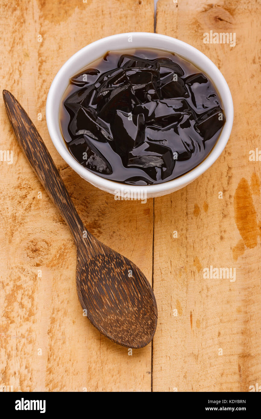 grass jelly or vegetable jelly on wood background Stock Photo Alamy