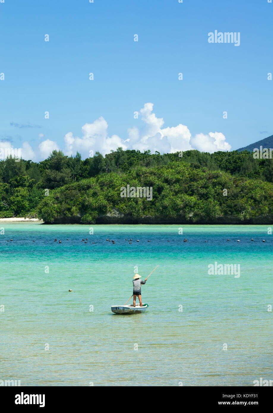Fisherman going to fish in crystal clear waters of  Kabira bay, Ishigaki-jima, Yaeyama Islands, Okinawa Prefecture, Japan Stock Photo