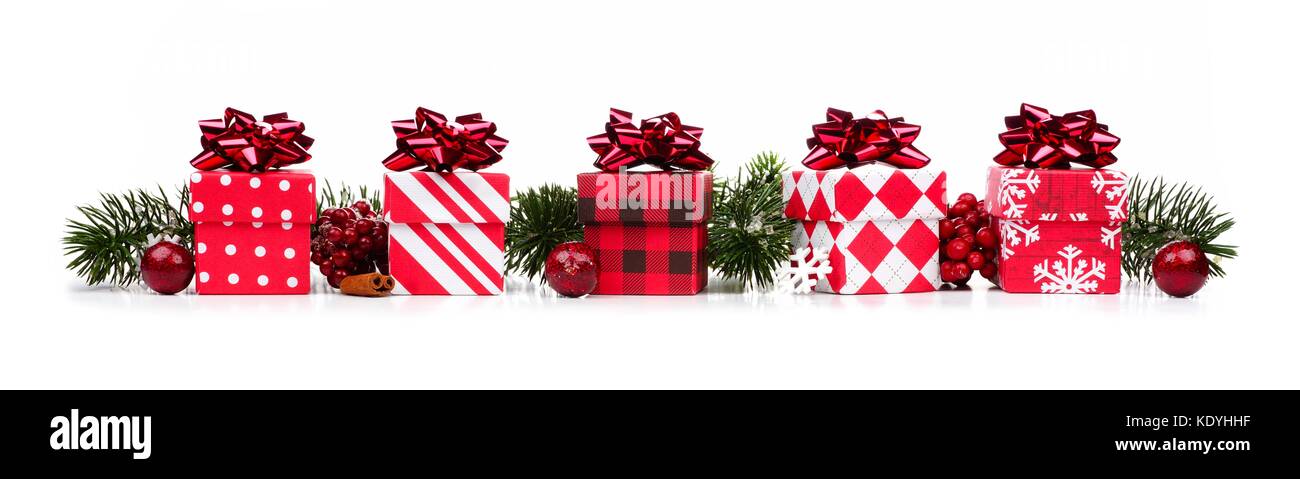 Christmas border of red and white gift boxes and branches isolated on a  white background Stock Photo - Alamy