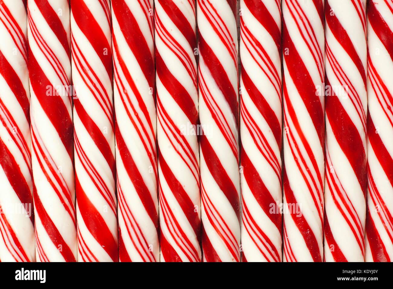Full background of red and white striped Christmas candy canes Stock