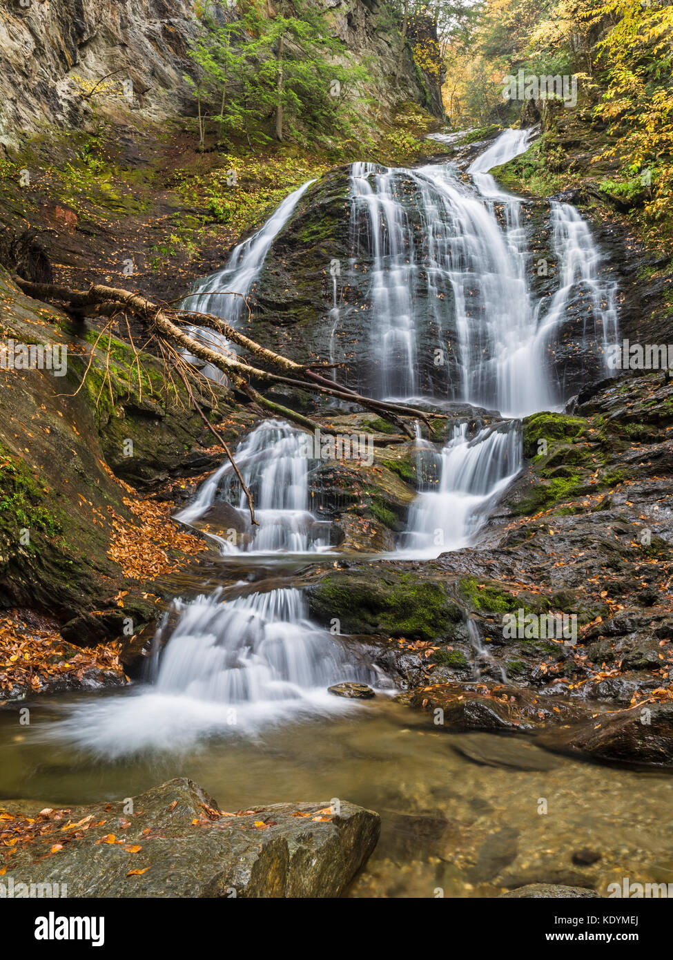 Moss Glen Falls in Autumn seen from the pool below in Stowe, Vermont Stock Photo