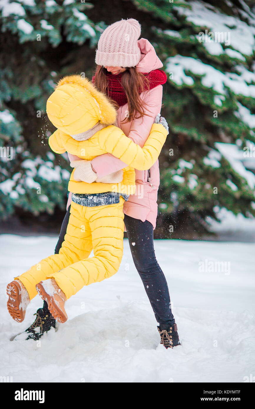 Happy family playing snowballs in the winter snowy day Stock Photo - Alamy