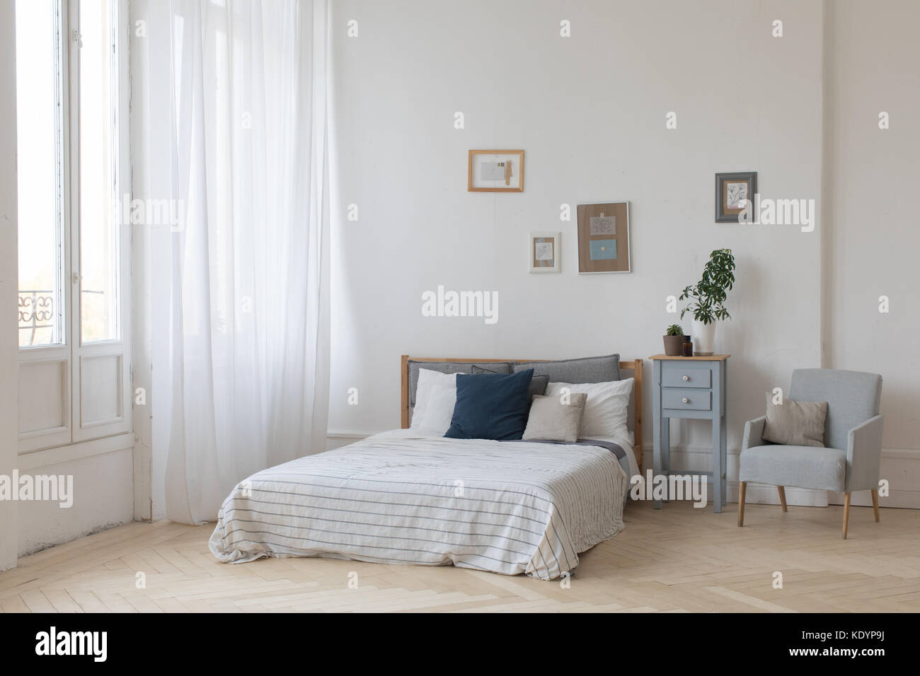 Cozy White Ethnic Bedroom Design Big Comfortable Bed White Sheets Stock  Photo by ©Milkos 599706986