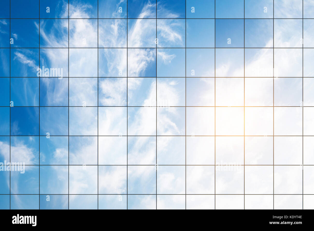 Clouds reflected in windows of modern office building Stock Photo - Alamy