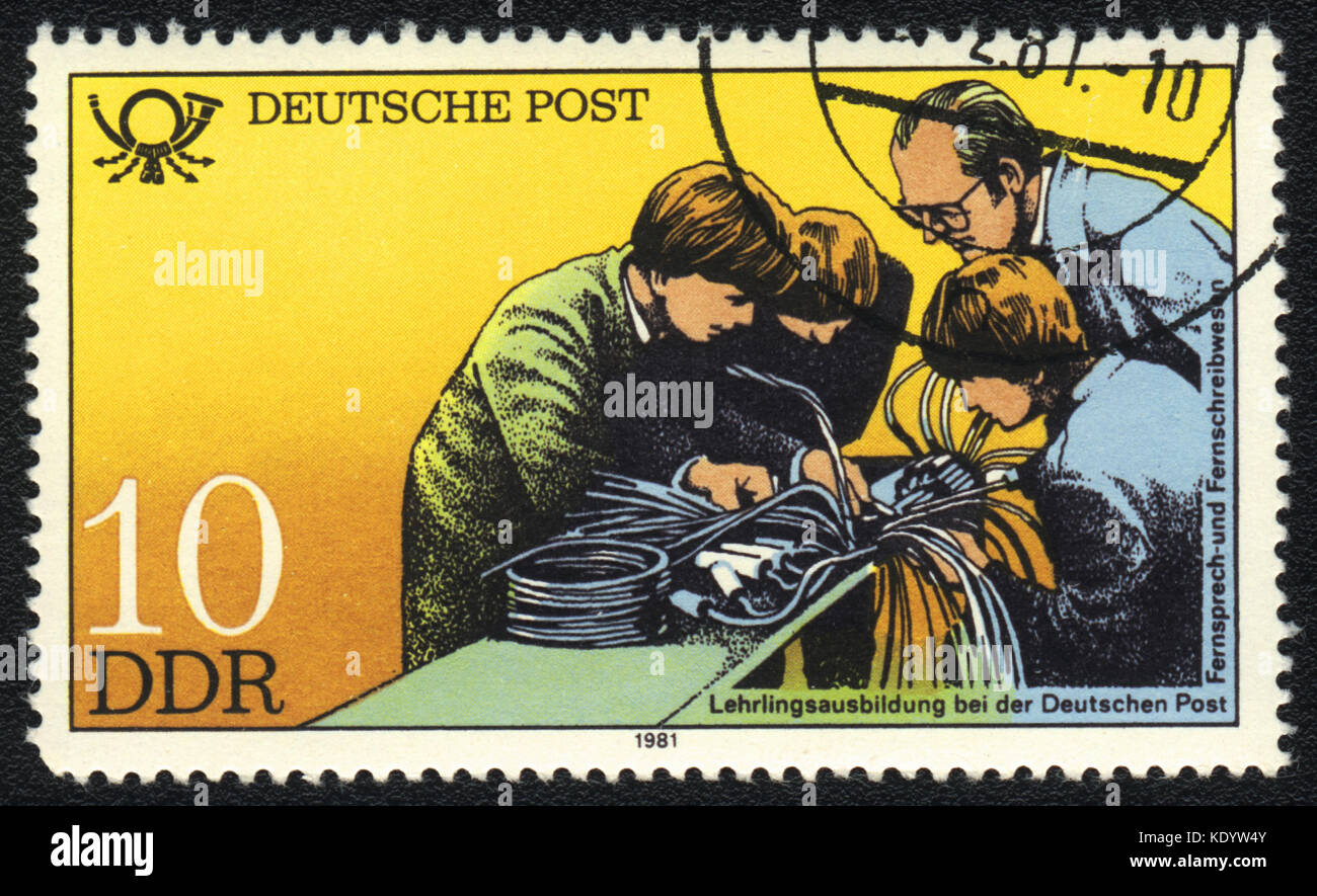 A postage stamp printed in DDR shows apprenticeship training, Postal History of Germany, circa 1981 Stock Photo