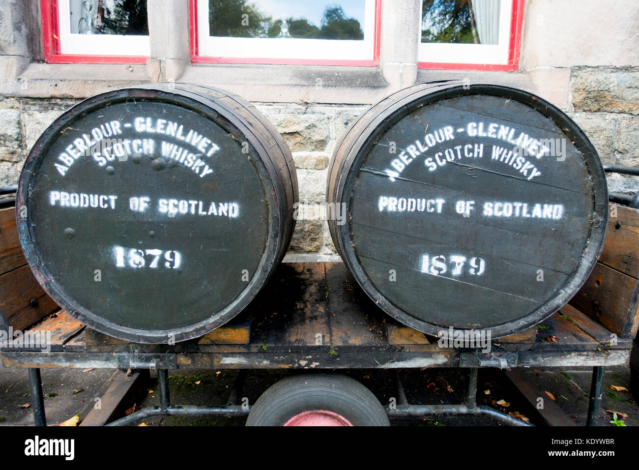 Whisky barrels outside the entrance building to Aberlour Distillery in the village of Aberlour, Scotland, UK Stock Photo