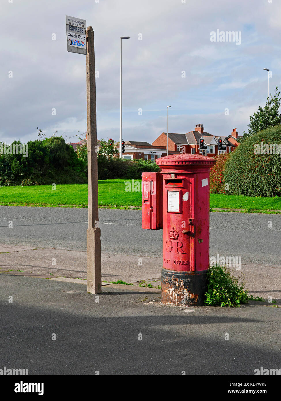 Old King sixth red pillar box next to old concrete bus stop