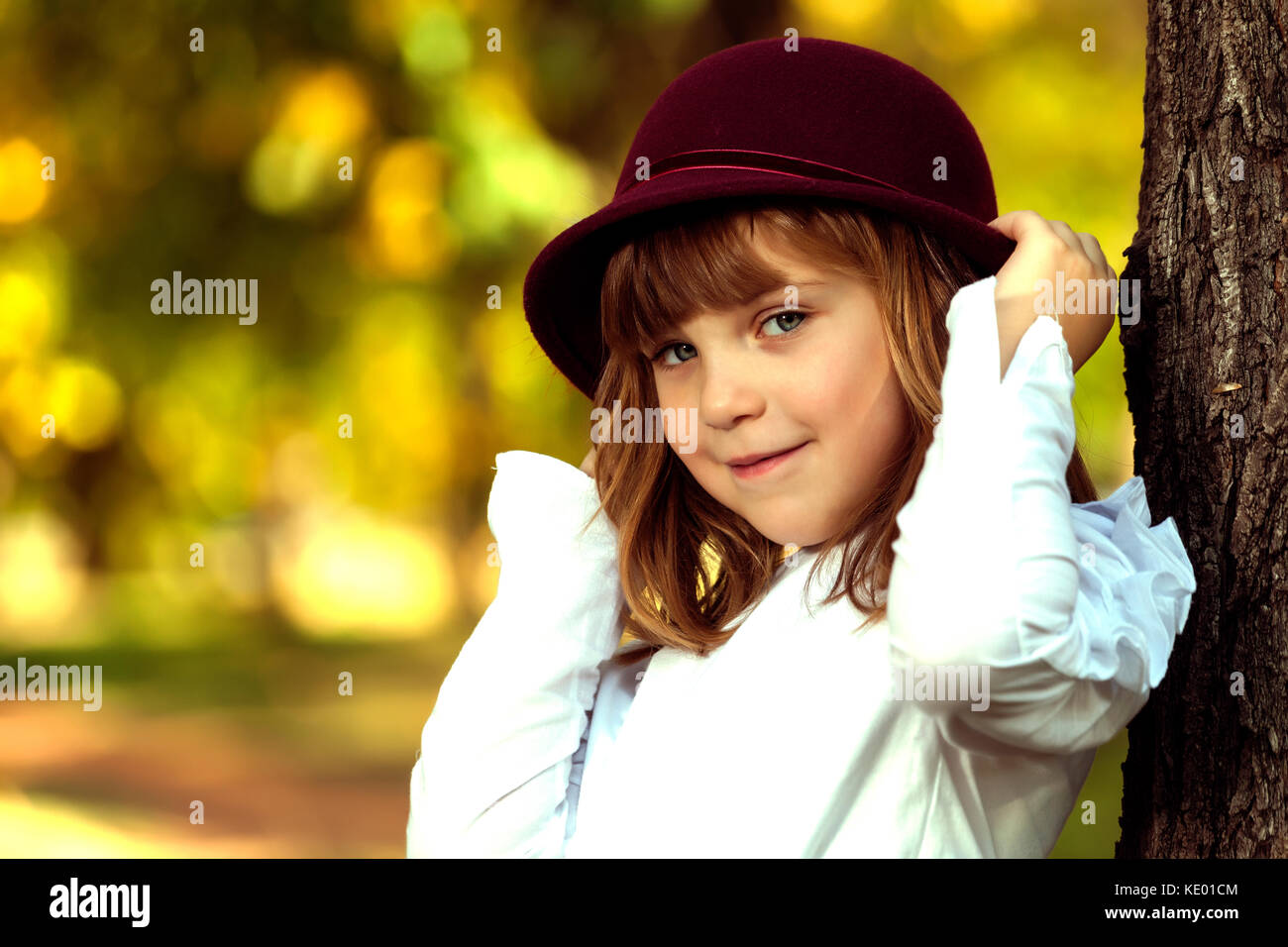 Close up portrait of a beautiful smiling little girl with a hat ...
