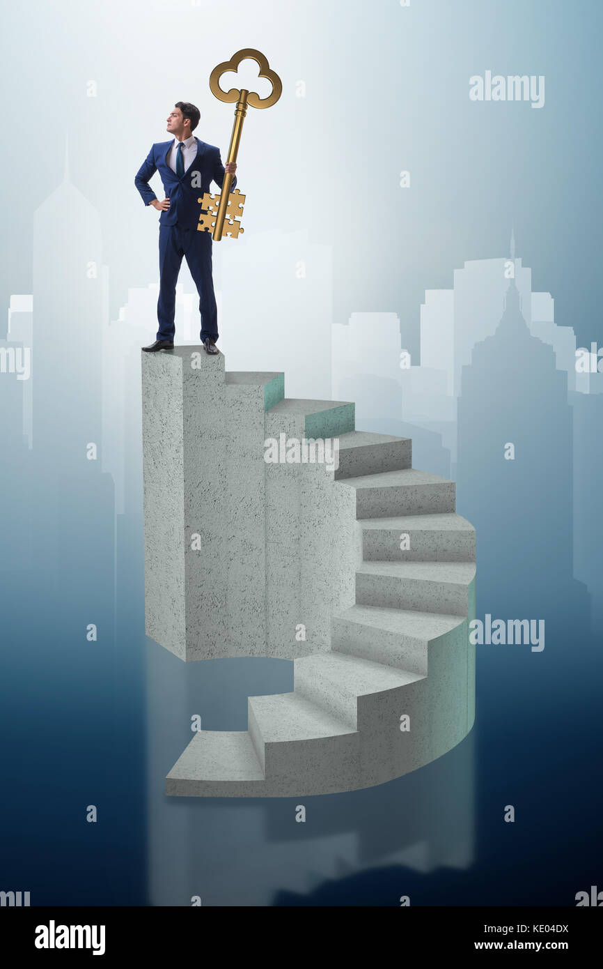 Businessman with key to success at the top of career Stock Photo - Alamy