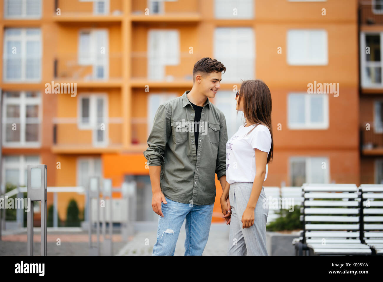 Happy young couple outdoors on sunny day Stock Photo