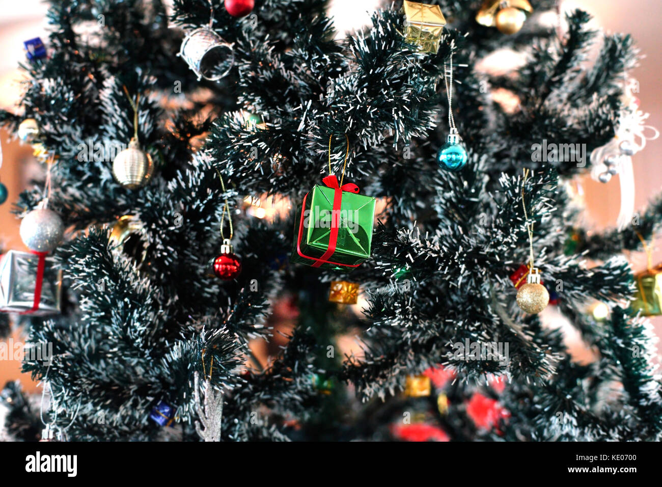 green gift boxes decorated on christmas tree Stock Photo - Alamy