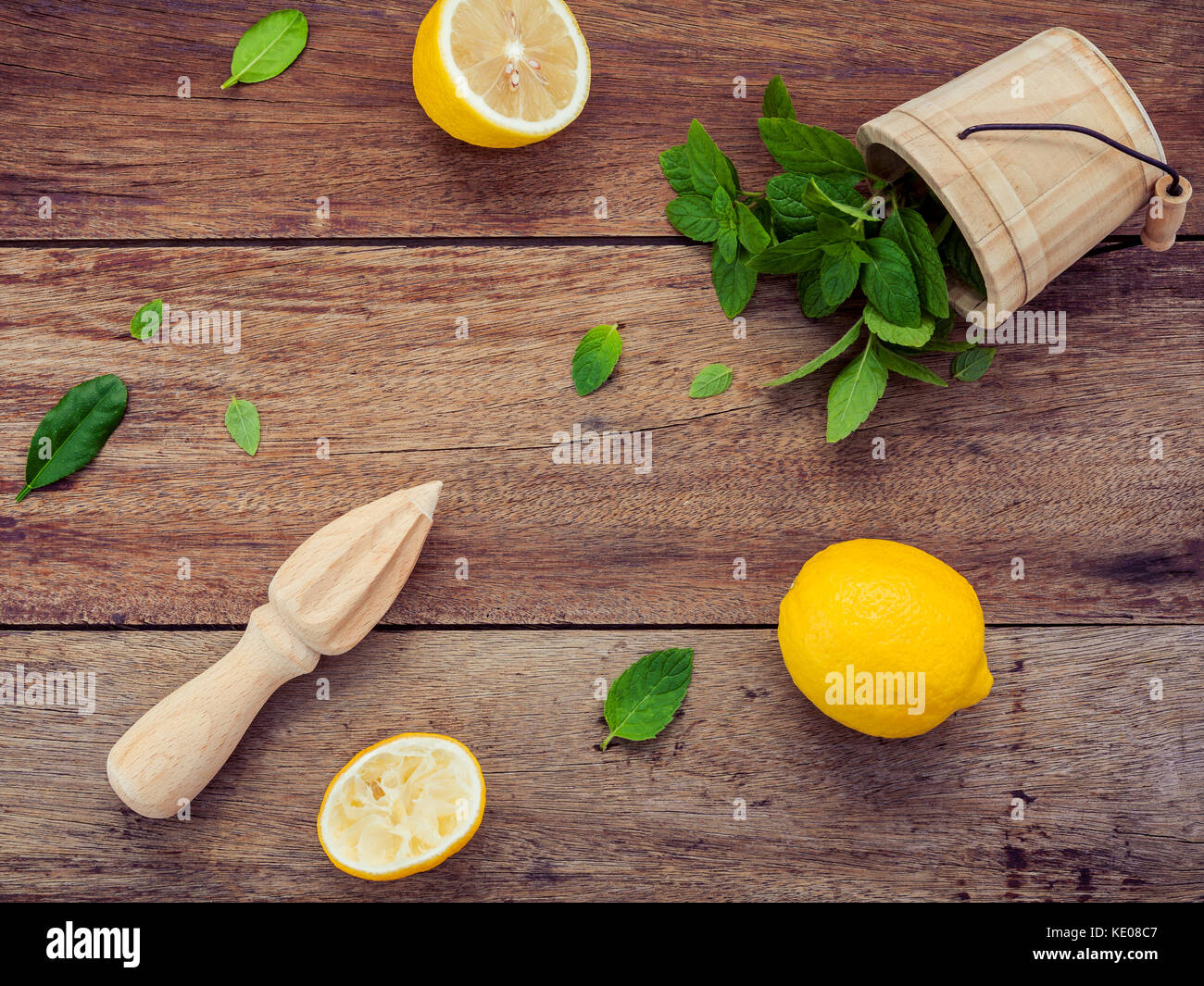 Fresh lemon and wooden juicer for summer juice and cocktail. Fresh