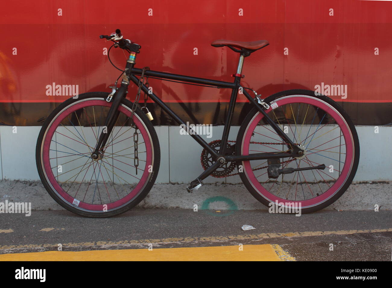 A Road Bike Against a Red and Black background. Stock Photo