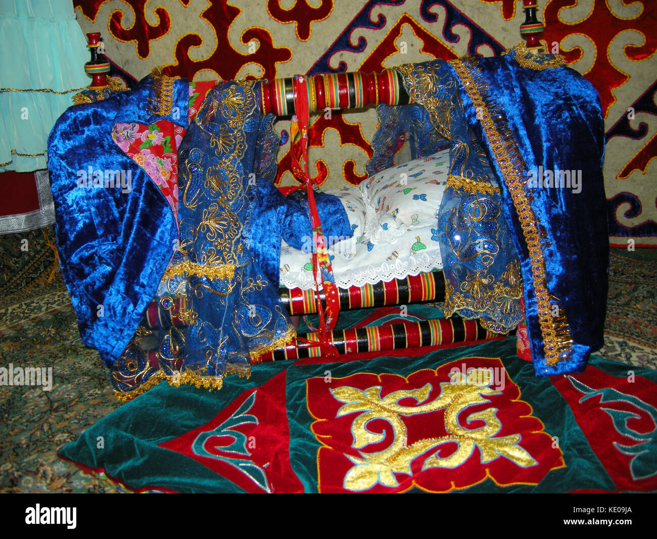 A colourfully decorated baby’s crib on display at an exhibit in the