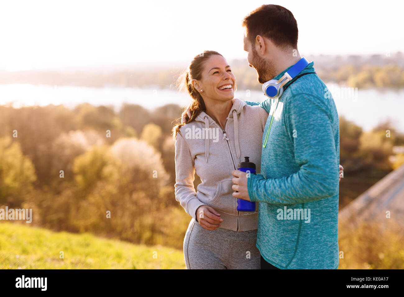Happy young sporty couple sharing romantic moments Stock Photo - Alamy