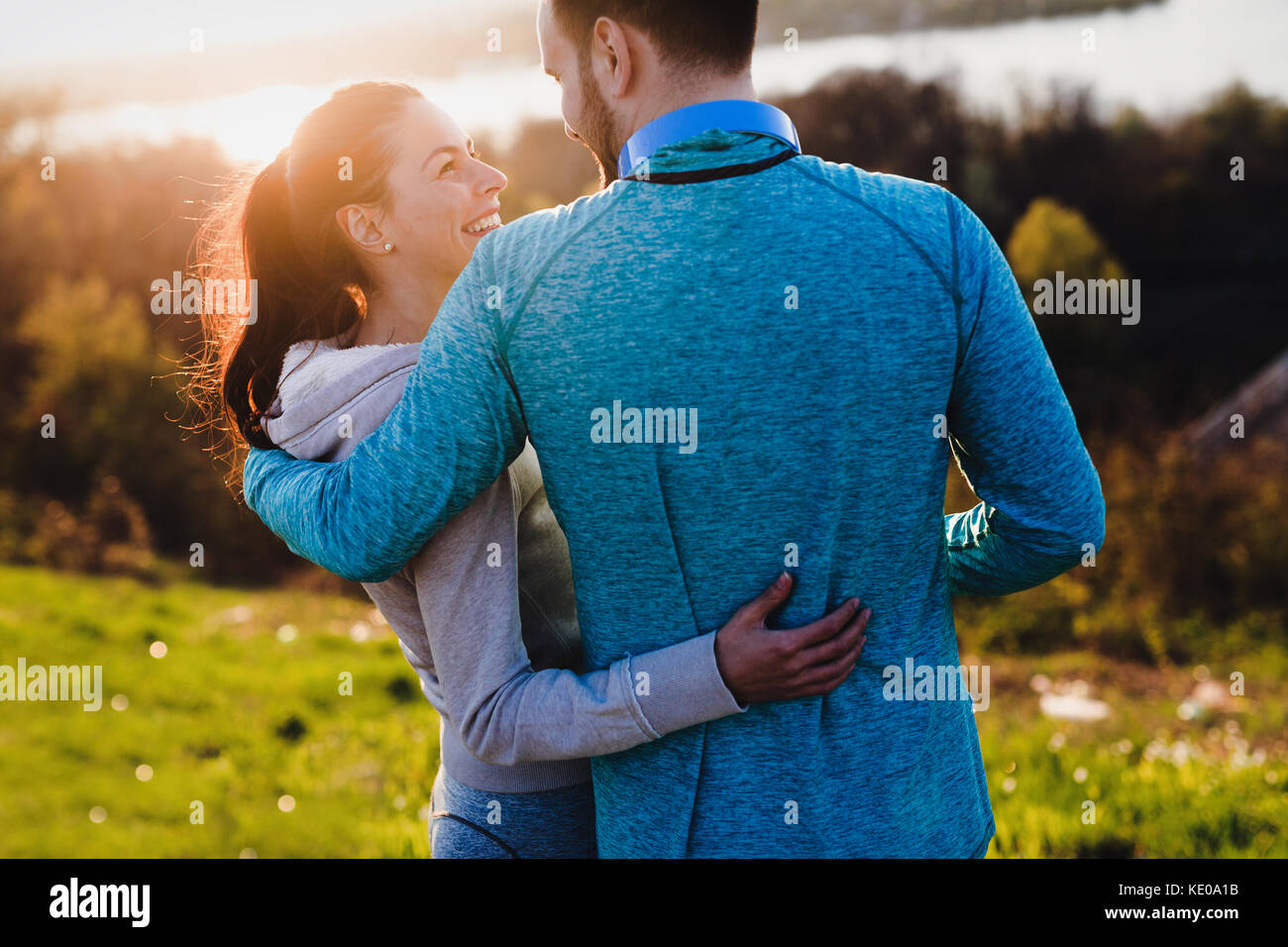 Happy young sporty couple sharing romantic moments Stock Photo - Alamy