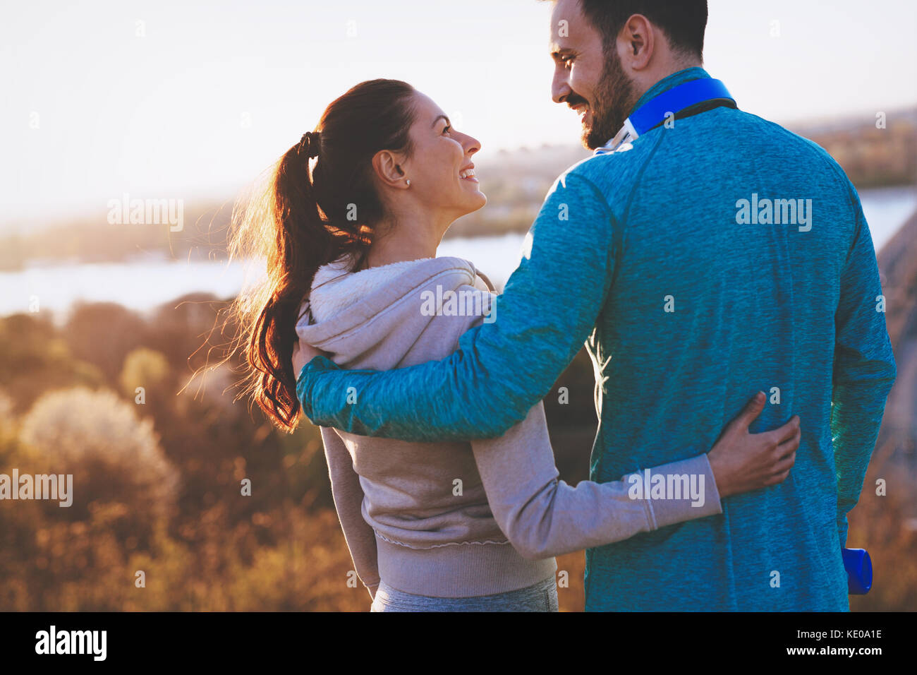 Happy young sporty couple sharing romantic moments Stock Photo - Alamy