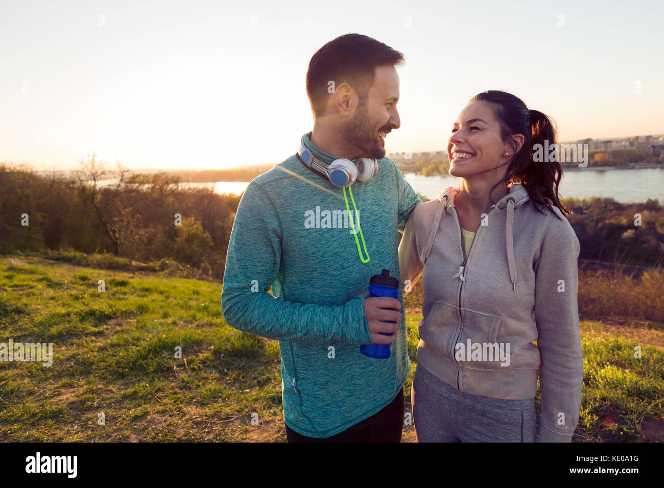 Happy young sporty couple sharing romantic moments Stock Photo - Alamy