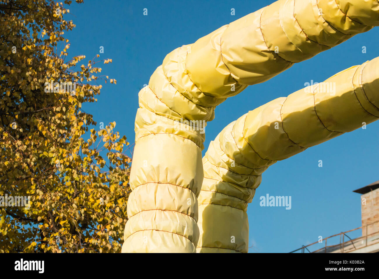 heat insulation of hot water pipes in autumn. Stock Photo